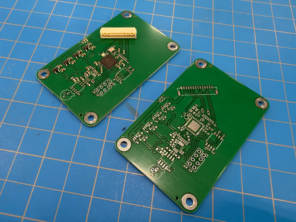 Partially assembled RX-A receiver beside an unpopulated receiver PCB.